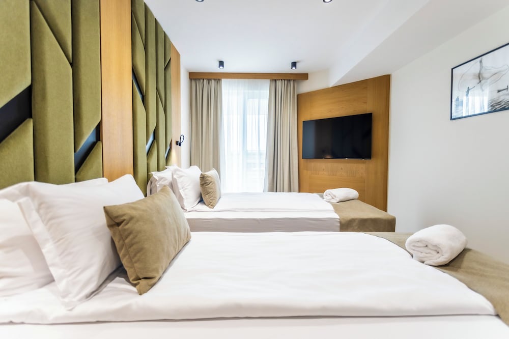 Deluxe Quadruple Room, Balcony, Beach View photo 1