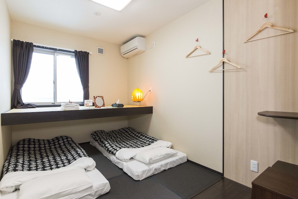 Private twin room with 1 Lofted bed, Shared Toilet and Shower