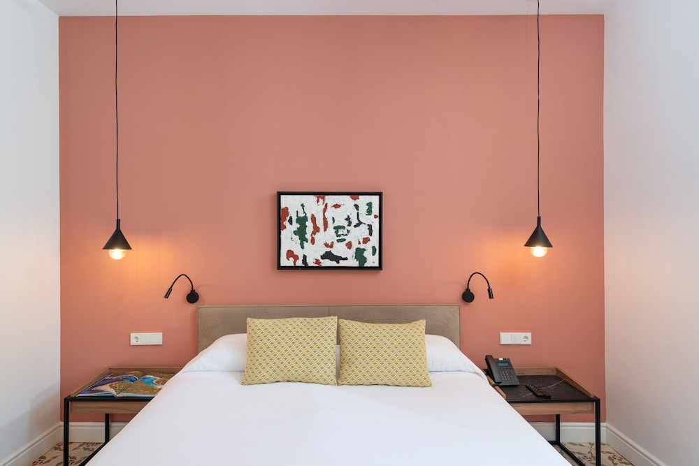 bedroom with a bed and two lamps on either side of the bed