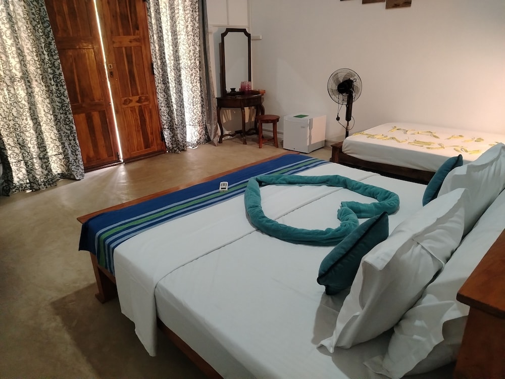 Deluxe Triple Room, Garden View photo 3