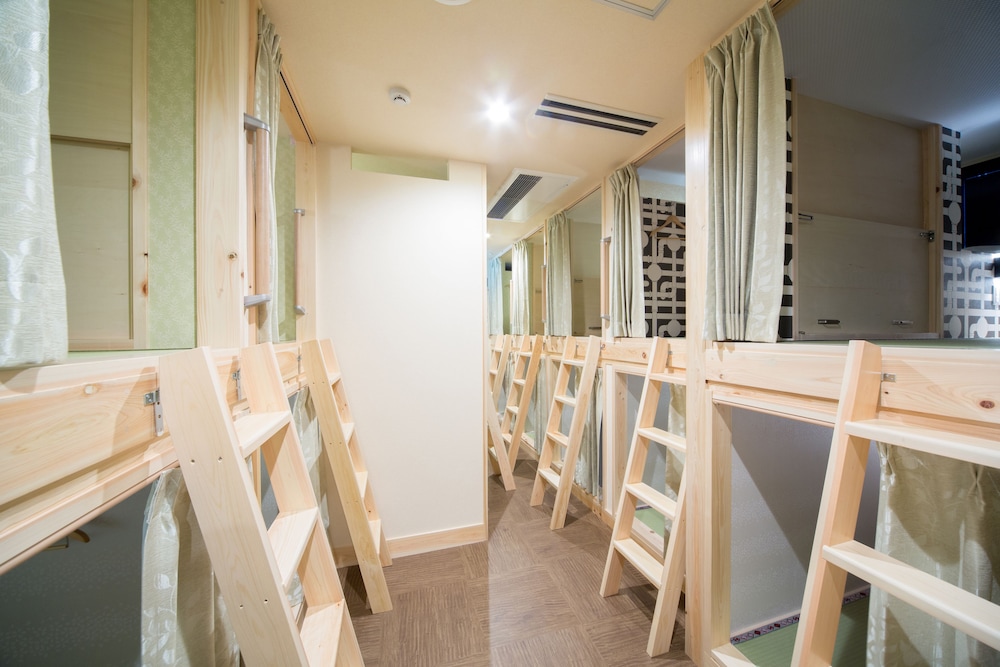 2 capsule beds at Shared Dormitory, partition can be opened/closed photo 2