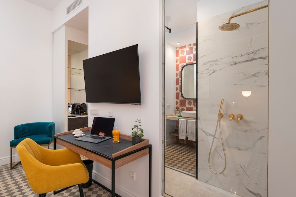 desk with a laptop on it and a yellow chair