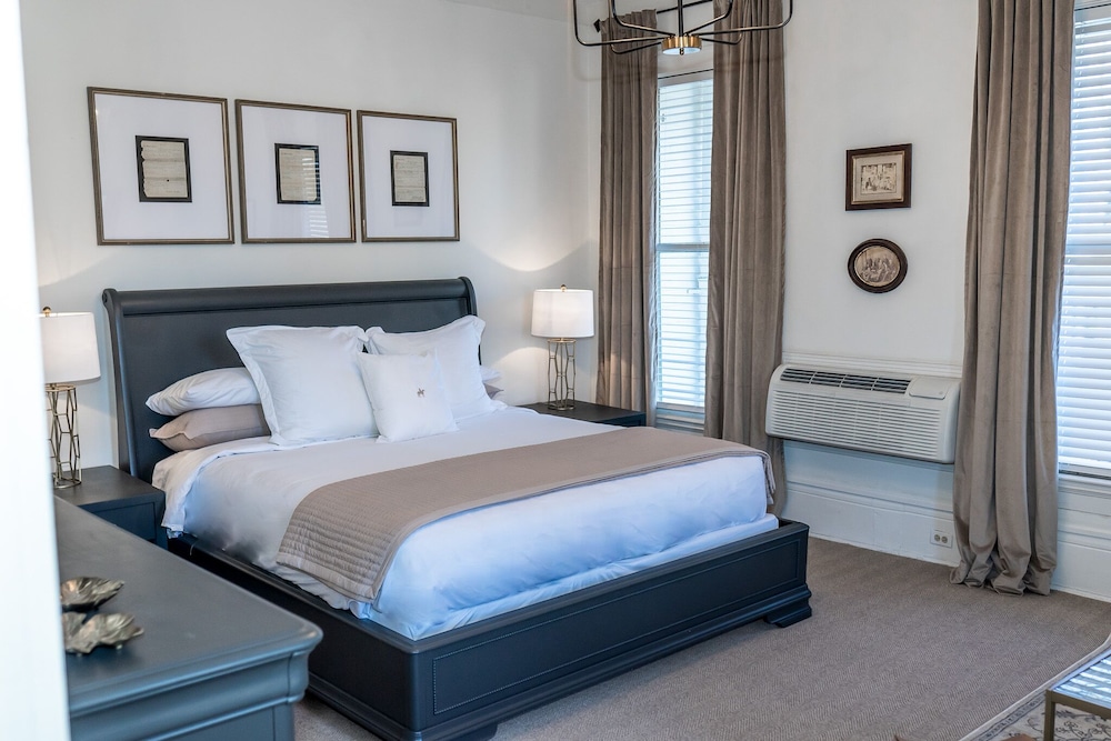 bedroom with a king size bed and air conditioner