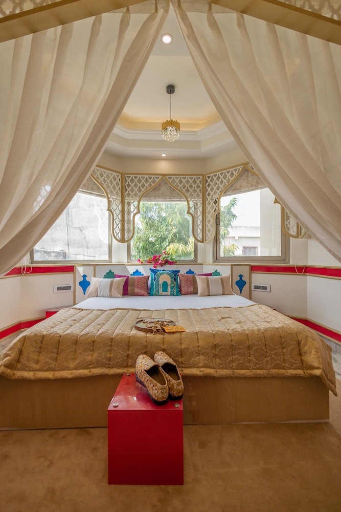 Mughal heritage room with 180 degree city view from Designer bed