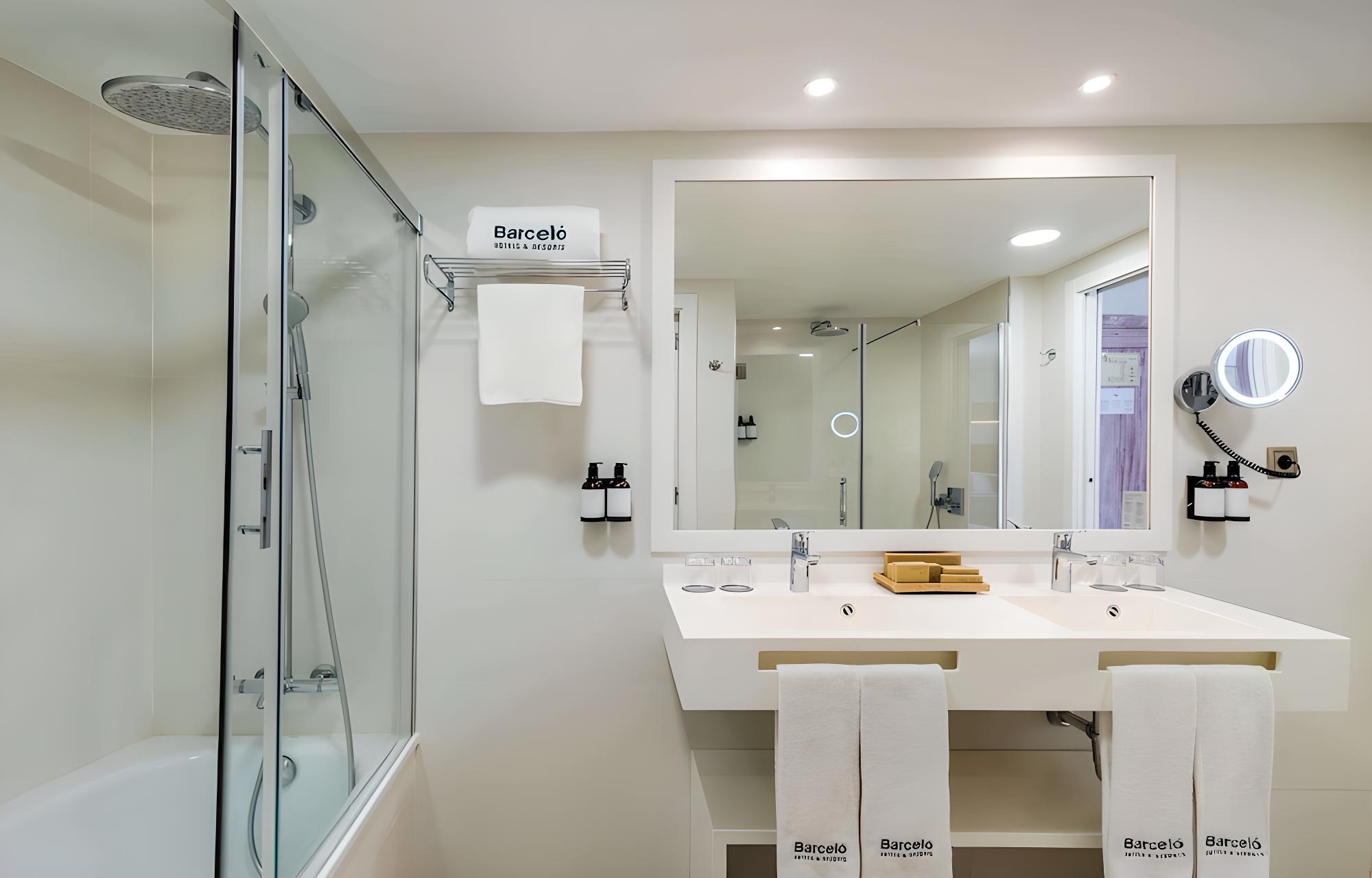Relax in this modern, spacious hotel bathroom.
