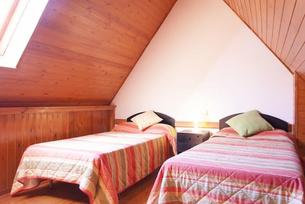 Habitación Cuádruple (1 cama doble y 2 camas individuales)