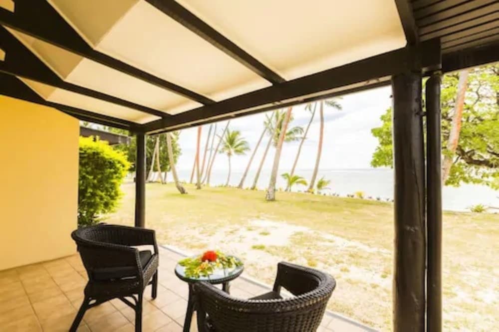 Beachfront Bure (1 Double and 2 Single Bed) photo 6