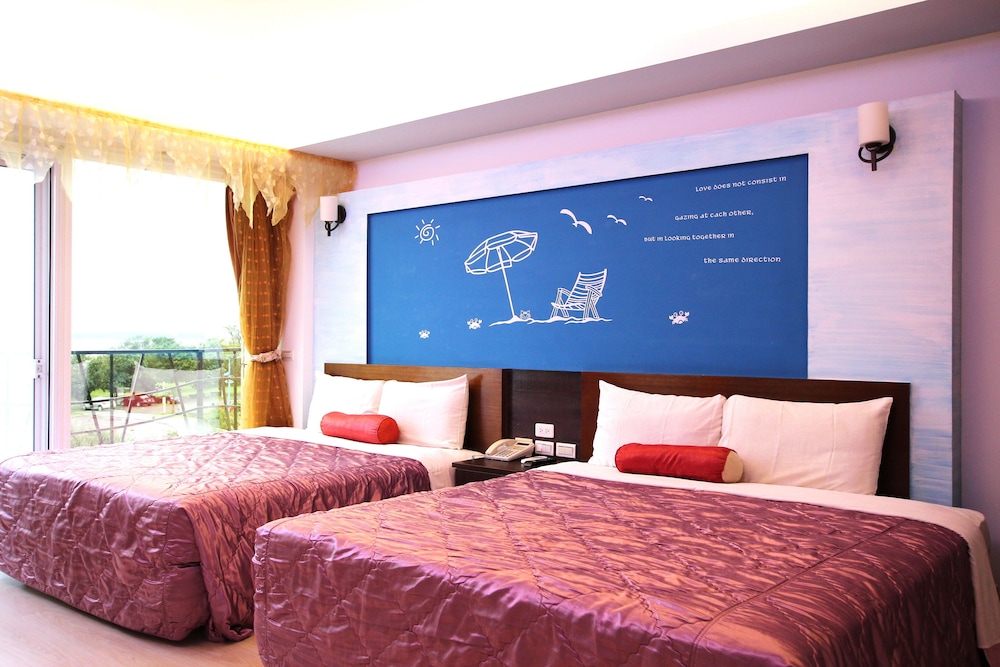 Deluxe Quadruple Room, 2 Queen Beds, Balcony, Sea View photo 1