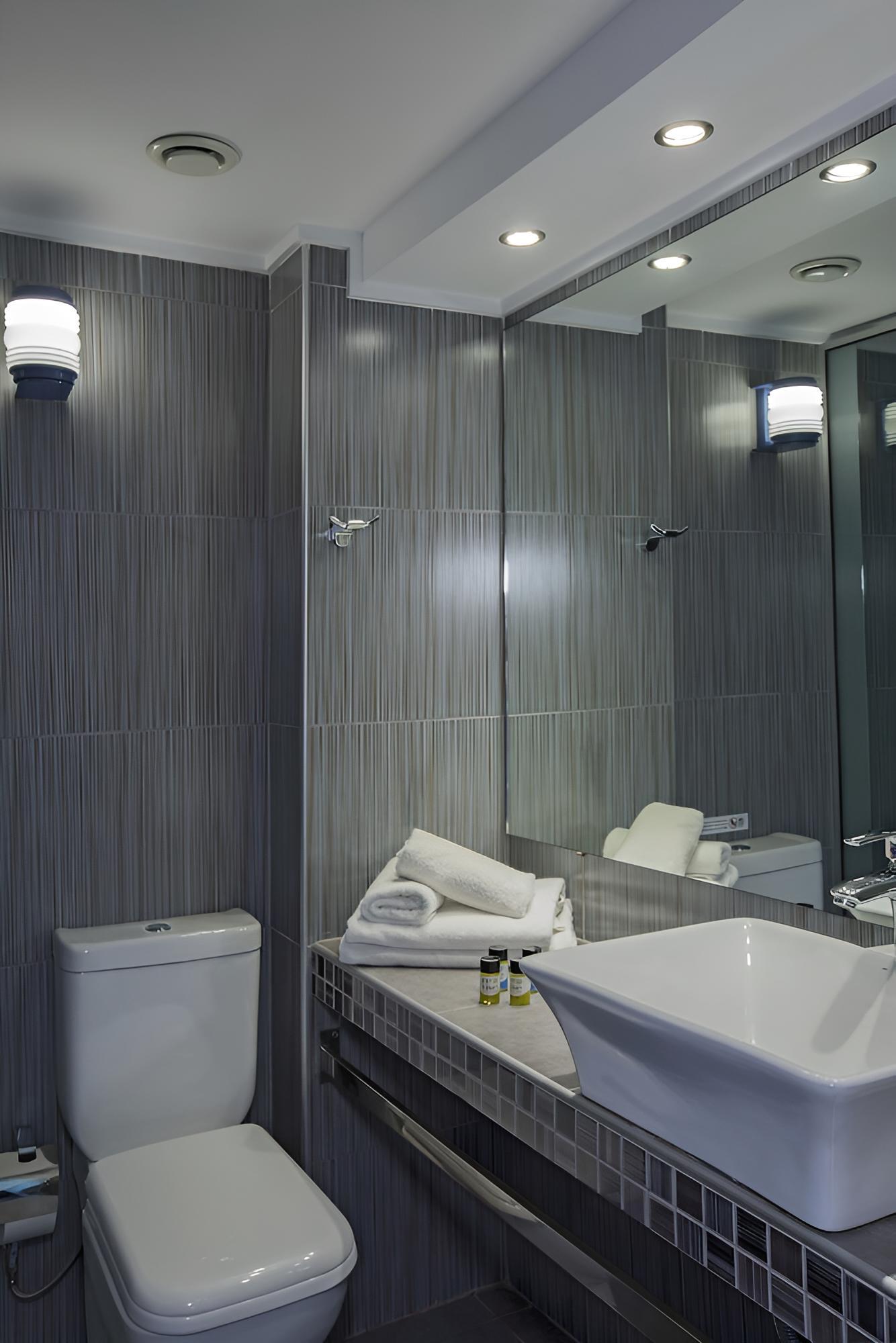 Relax in a sleek, modern bathroom retreat.