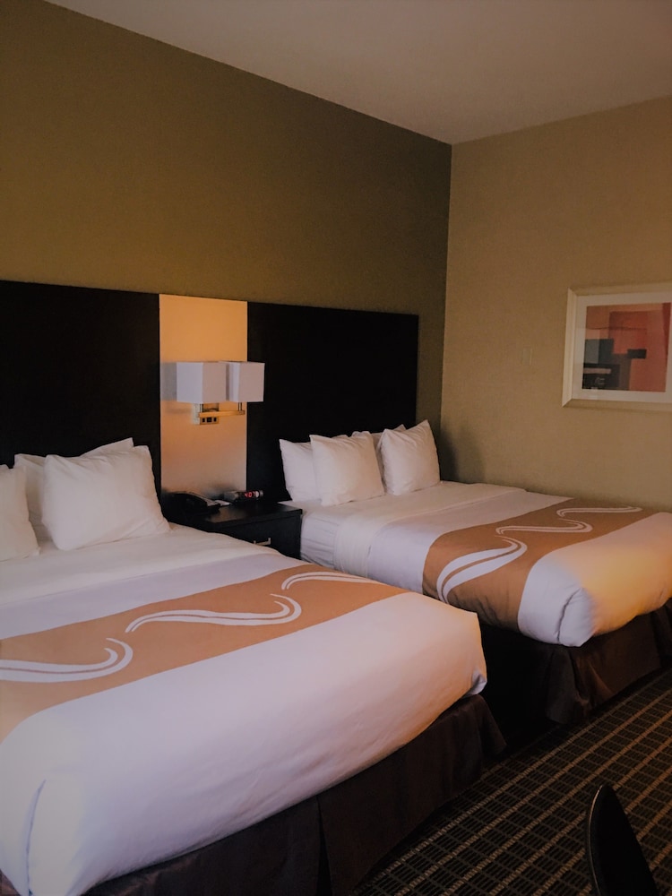 hotel room with two queen sized beds and a desk