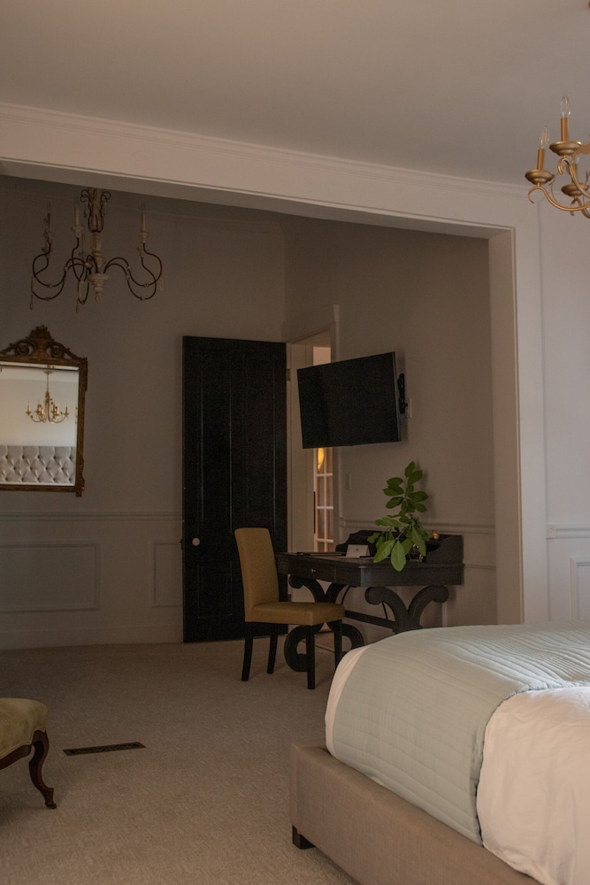 bedroom with a chandelier hanging from the ceiling