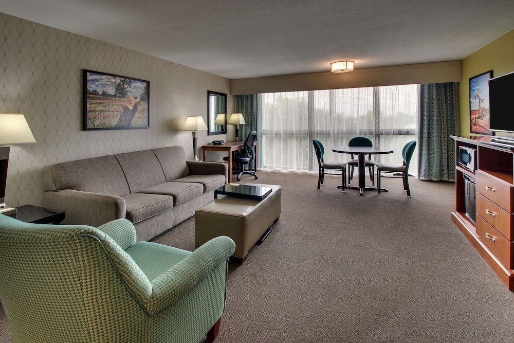 Suite, 1 King Bed With Sofa Bed, Refrigerator & Microwave (Oversized) photo 1