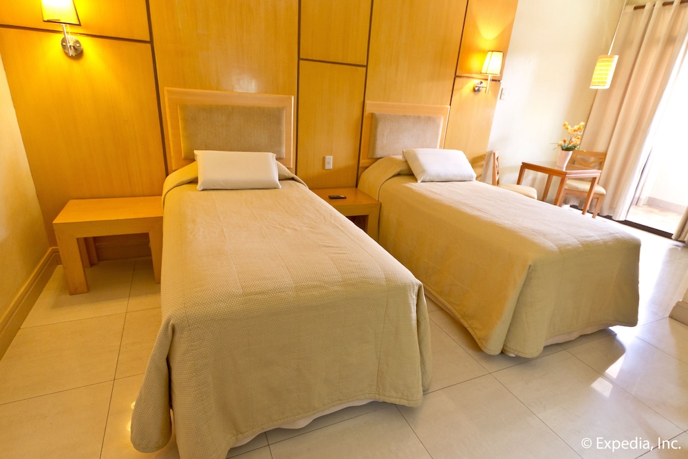 hotel room with two beds and one table? it looks like the other