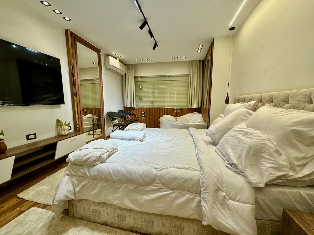 Luxury Jacuzzi Pyramids View Suite photo 1