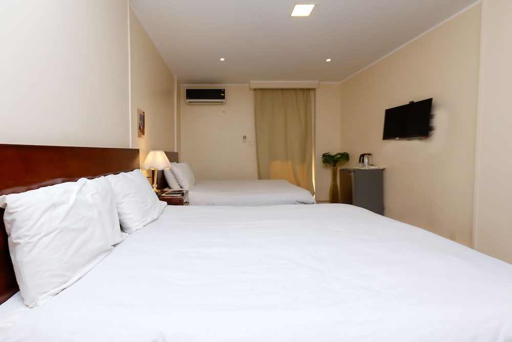 Deluxe Quadruple Room, 2 Double Beds, Balcony, City View