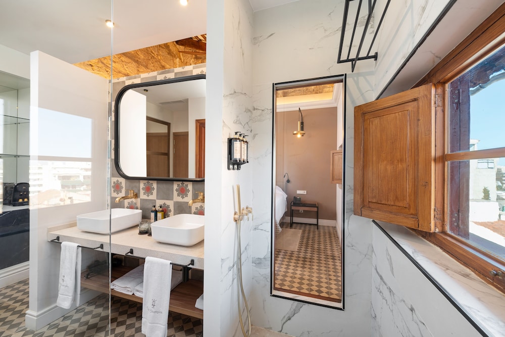 bathroom with two sinks and a large mirror on the wall