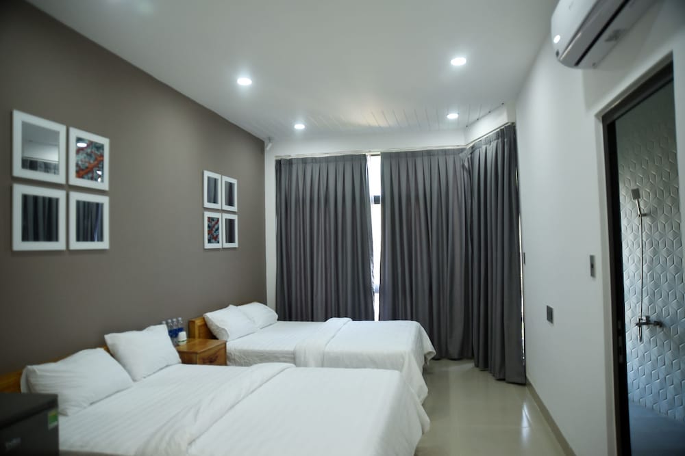 Deluxe Quadruple Room, 2 Queen Beds, Beach View