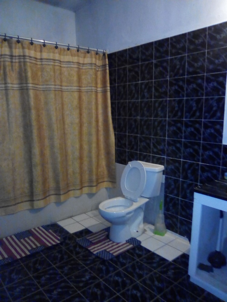 Basic Quadruple Room, 2 Double Beds, Balcony, Garden View photo 3