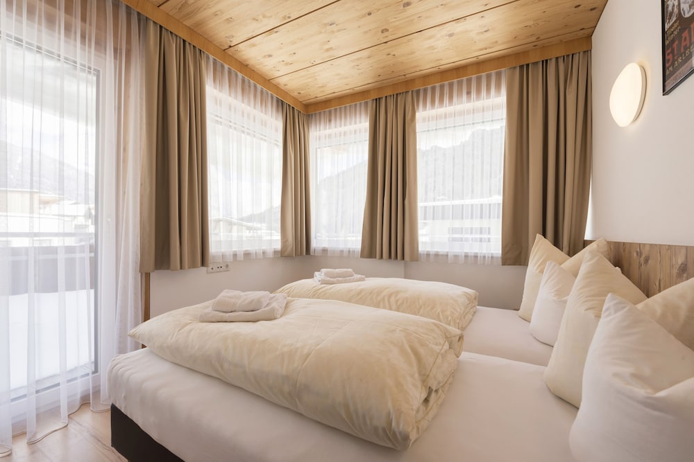 Family with 1 seperate bedroom room and 2 extra beds. 2 adults and 2 children