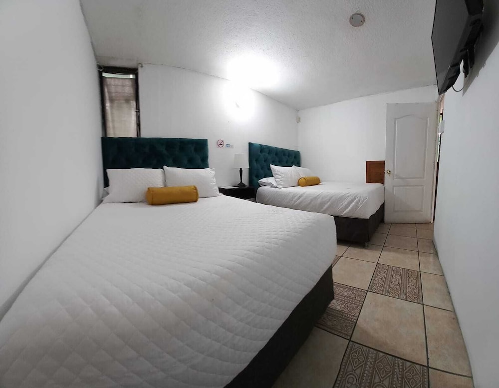 Economy Quadruple Room, 2 Double Beds, Non Smoking, Private Bathroom photo 1