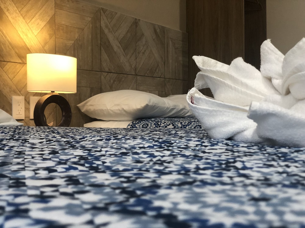 Номер «Делюкс» с двуспальной кроватью, несколькими кроватями, для некурящих