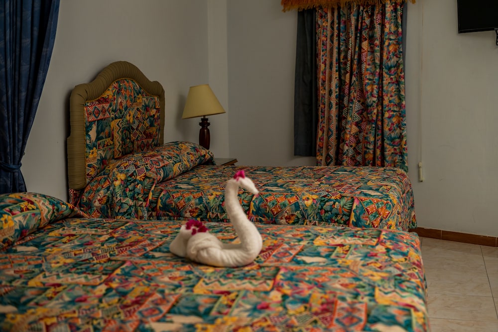 Deluxe Quadruple Room, 2 Queen Beds, Garden View photo 2