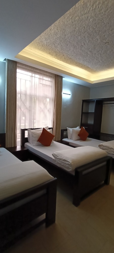 Deluxe Triple Room, Balcony, Garden View