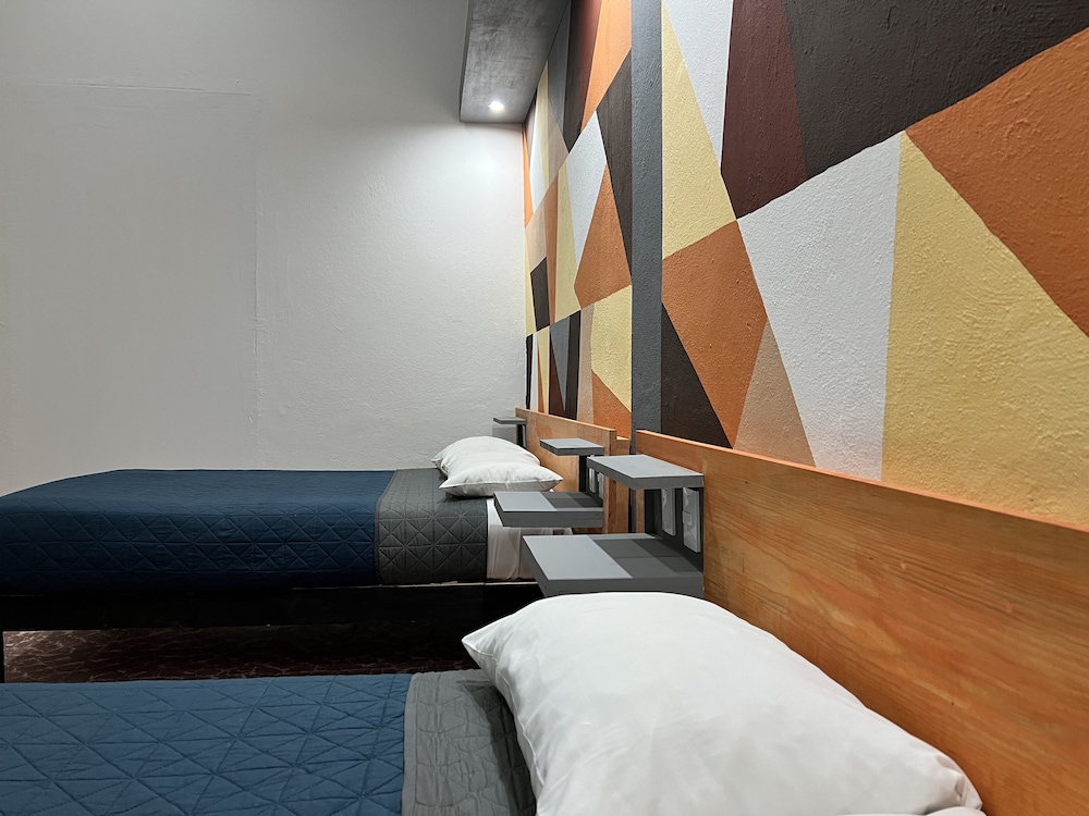 Basic Quadruple Room, 2 Queen Beds, Non Smoking, Shared Bathroom photo 1