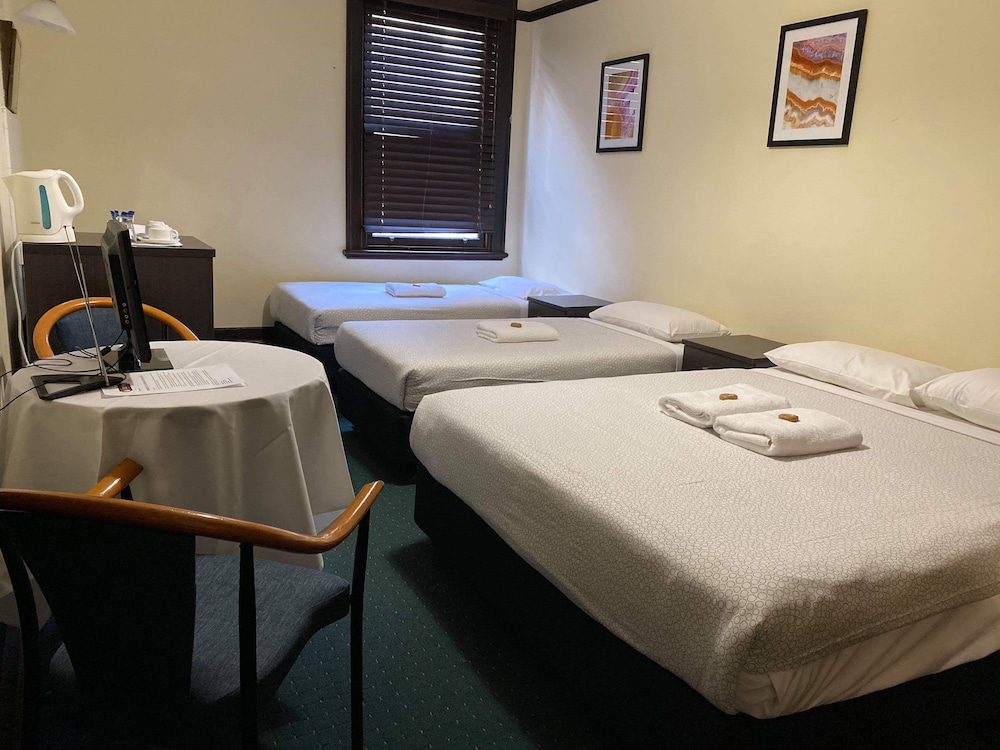 Quadruple Room (1 Queen and 2 Single) with Shared Bathroom