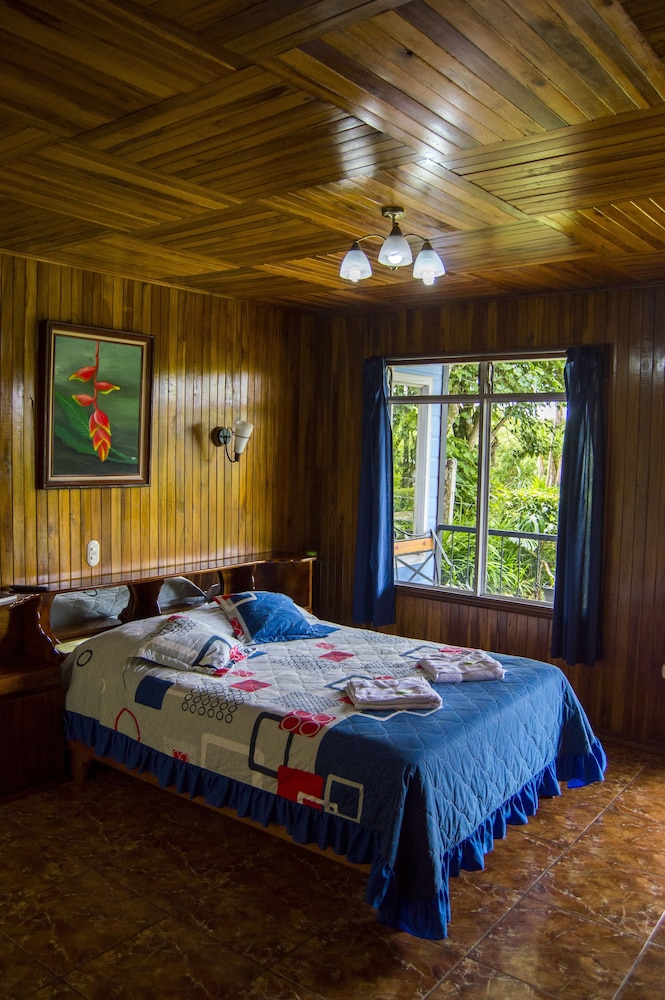 Standard Quadruple Room, 2 Double Beds, Balcony, Garden View photo 2