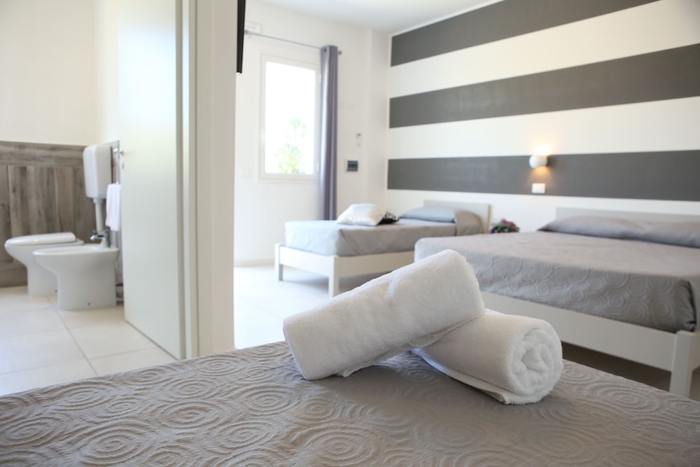 Deluxe Quadruple Room, Garden View - Photo 1
