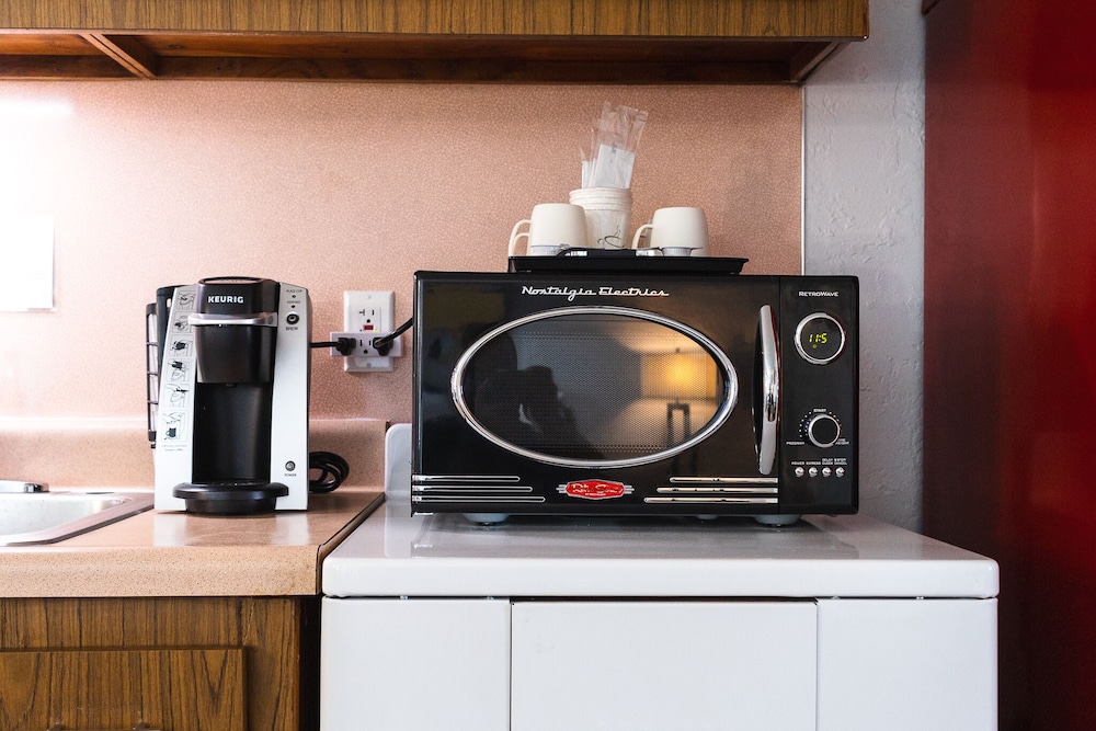 Coffee maker and microwave on counter