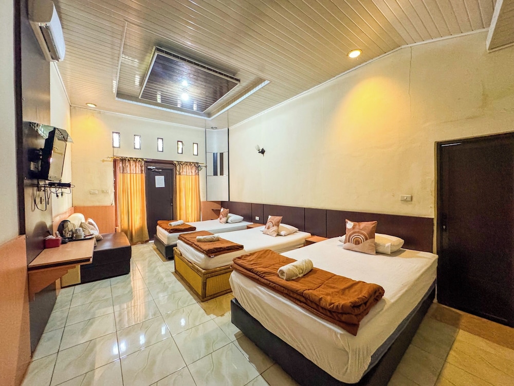 Deluxe Triple Room, Balcony, Garden View