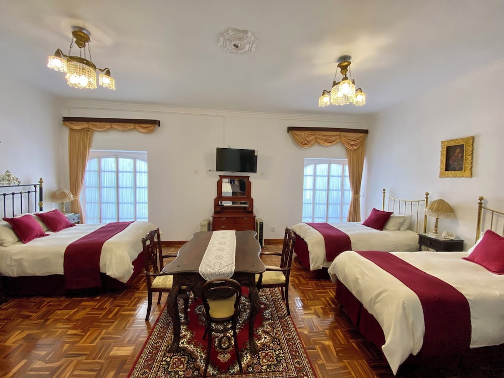 Deluxe Quadruple Room, 1 Bedroom, Private Bathroom, Courtyard View