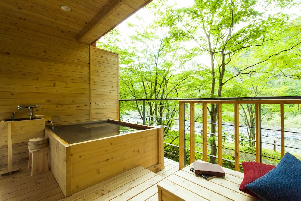 Outdoor bath with mountain stream side tatami room photo 3