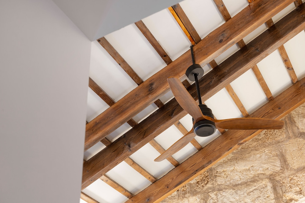 close up of a ceiling fan hanging from the ceiling