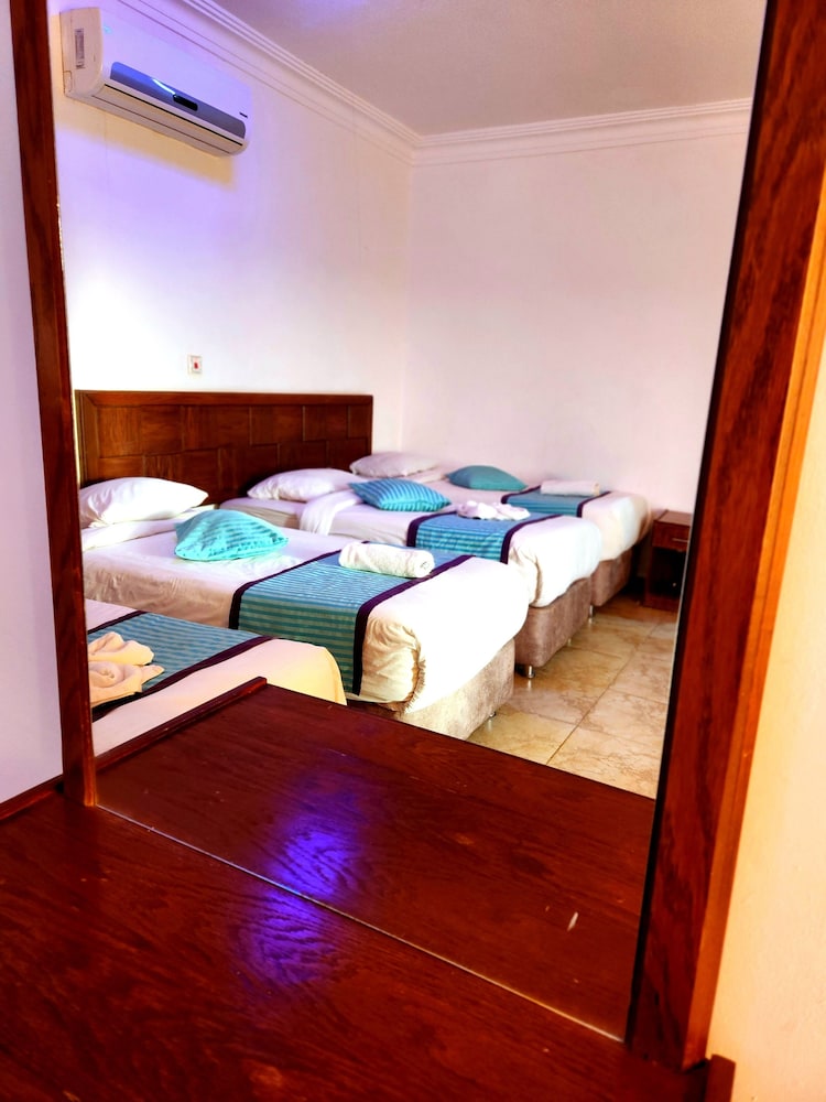 Deluxe Quadruple Room, 1 Bedroom, Balcony, Poolside photo 2