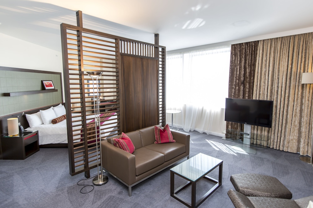 Premier King Family Room with Sofa / Rollaway Bed photo 1