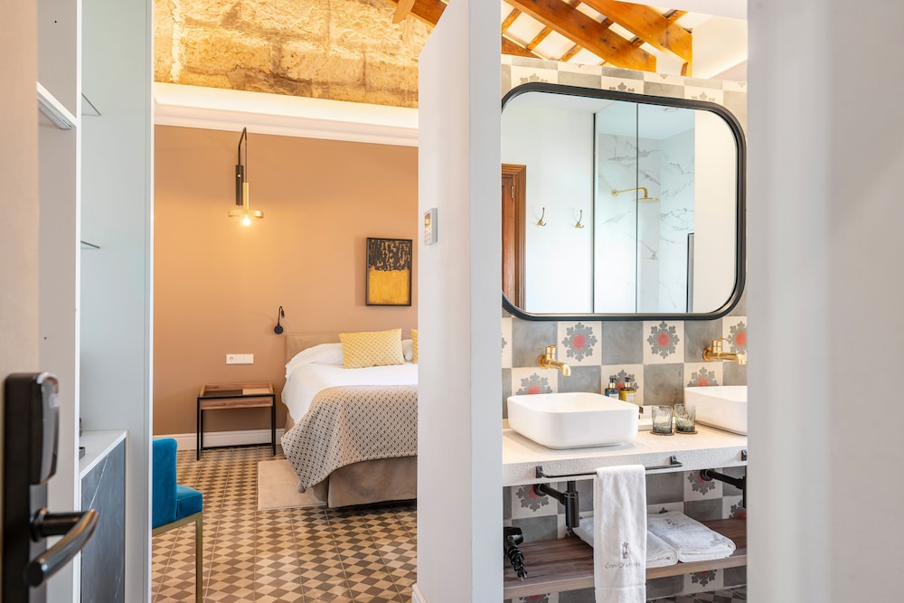 bathroom with a checkered floor and a large mirror
