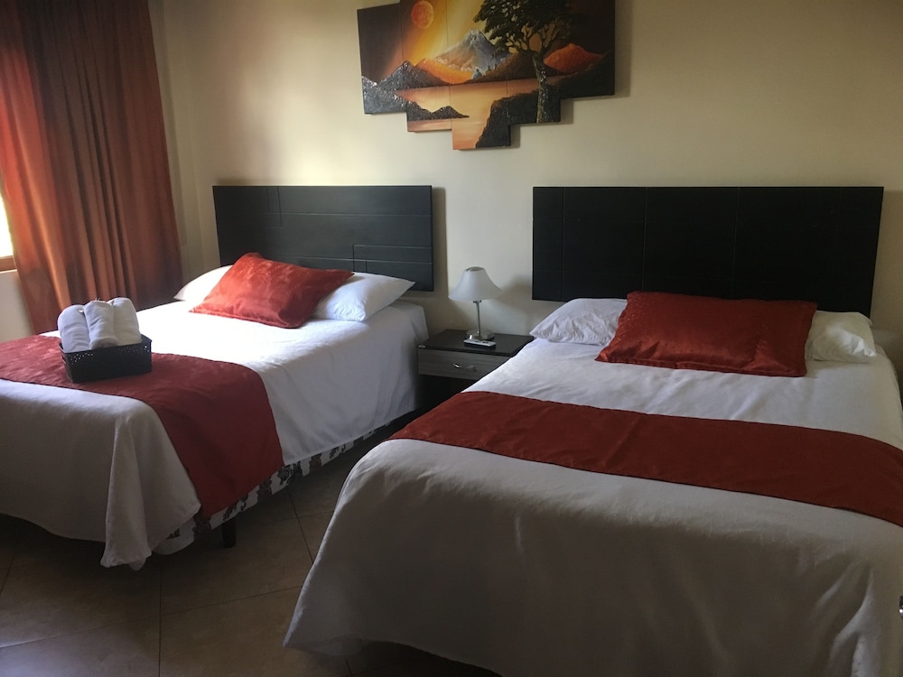 Deluxe Triple Room, 2 Queen Beds, Garden Area photo 2