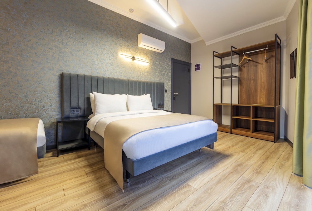 Deluxe Quadruple Room - Photo 9