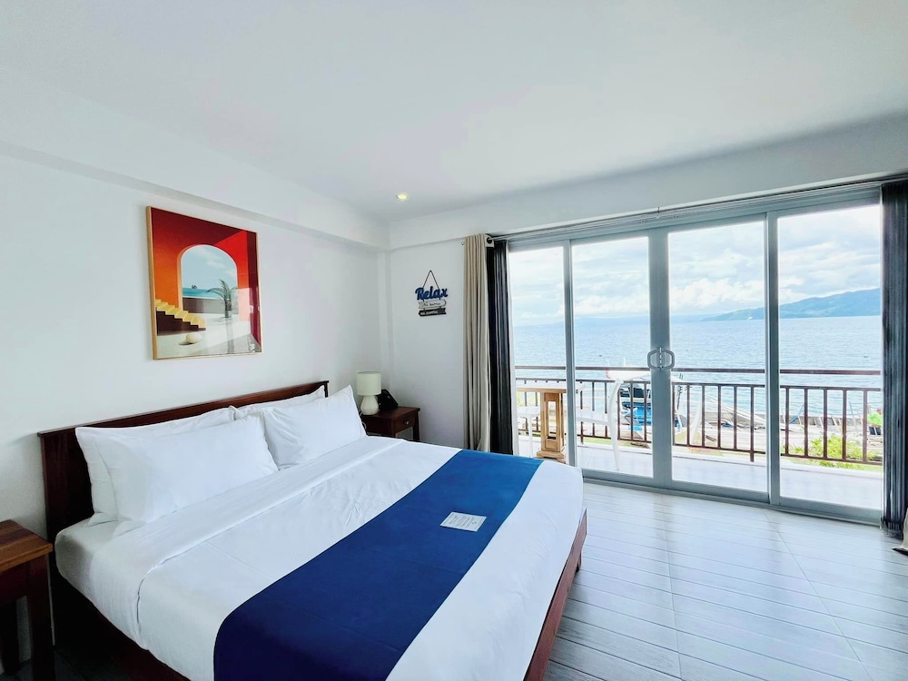 Deluxe Room, Balcony, Beach View - Photo 1