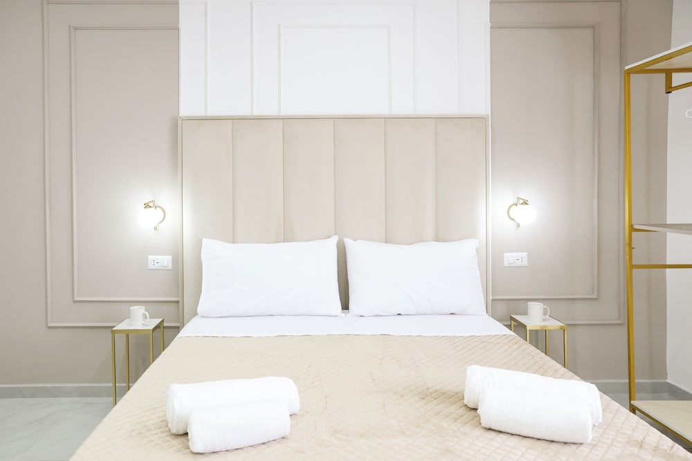 Room with beige bed