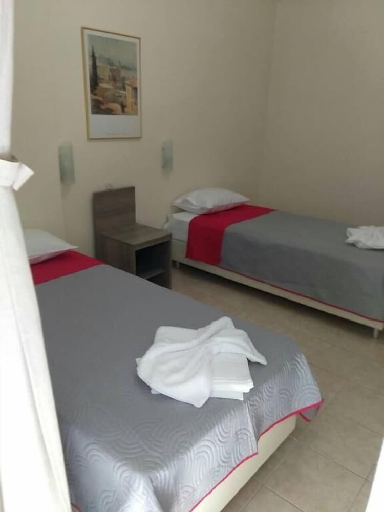 Twin Room (2 Adults + 1 Child)
