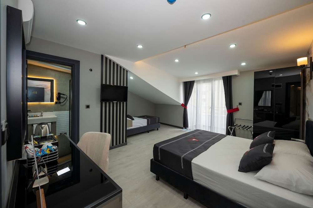Deluxe Triple Room - Photo 12