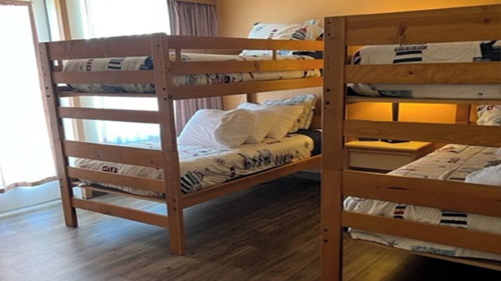 Family Suite, 1 King Bed w/ 2 sets of child size bunk beds, Dune View (Dog Friendly Room) photo 2