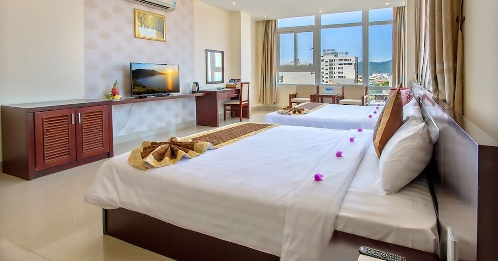Deluxe Triple Room, Multiple Beds, Partial Ocean View