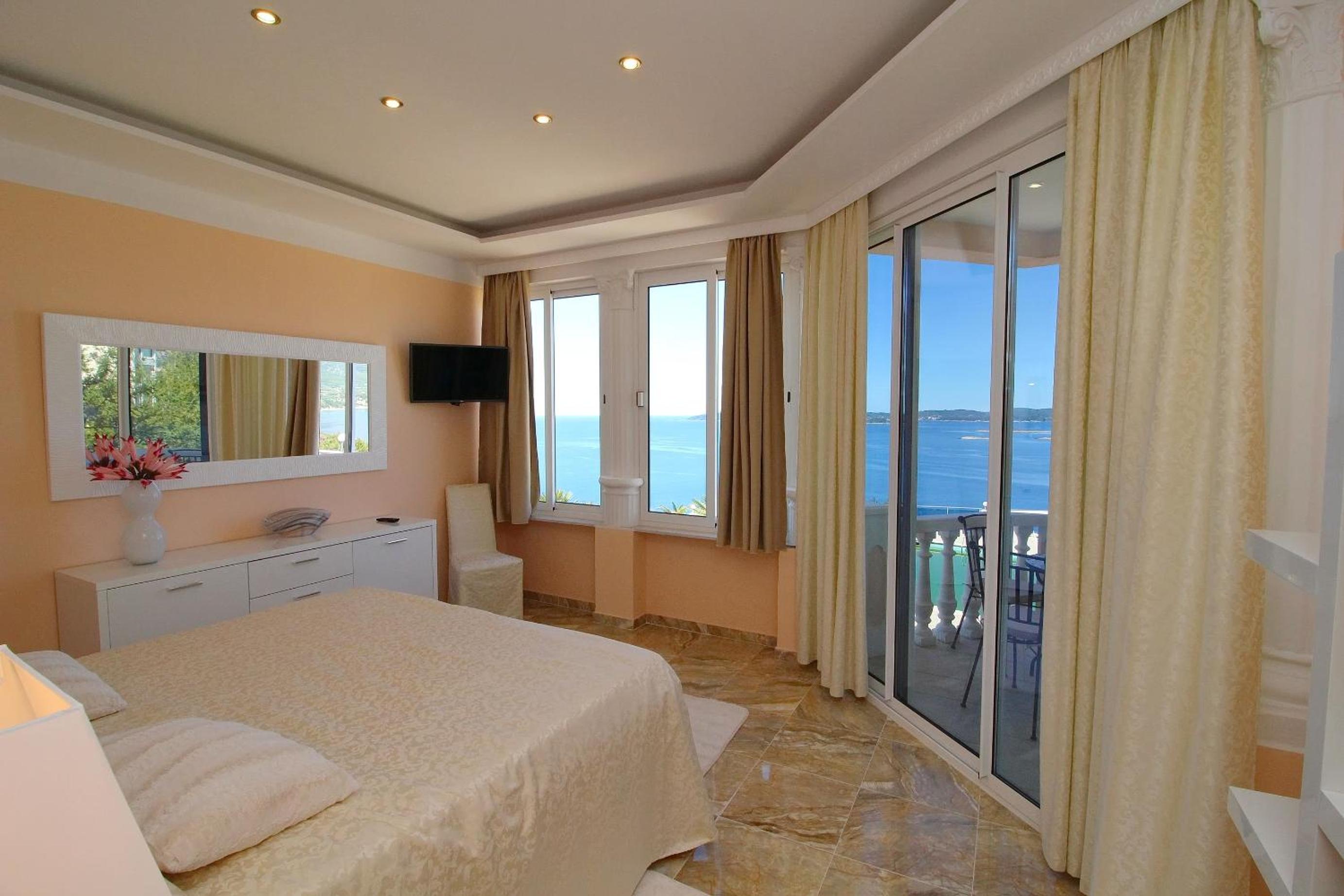 Two-Bedroom Royal Suite with Balcony and Sea View