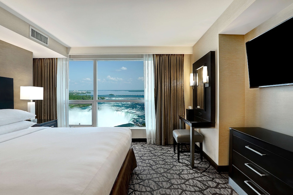 King Bed with Sofa Bed and partial view of Niagara Falls - Floors 10-25