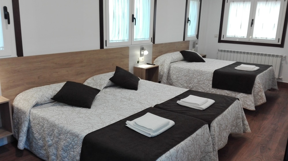 Habitación Cuádruple (2 camas individuales y 1 cama doble)